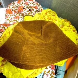 New Lack of color terry cloth bucket hat. Never worn.